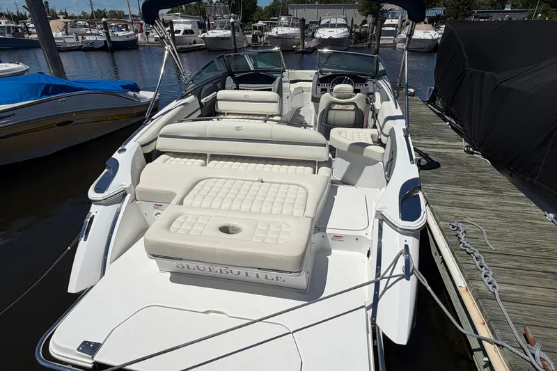 Slide: The Image of 2020 Cobalt R3 boat docked, featuring spacious seating and sleek design. - 19