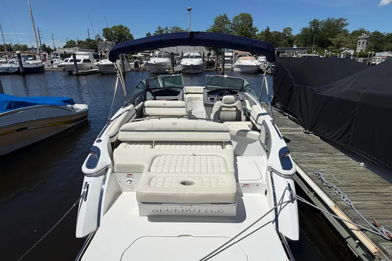 Slide: The Image of 2020 Cobalt R3 boat docked at marina with spacious seating and canopy. - 20