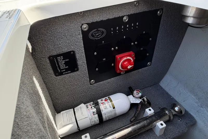 Slide: The Image of Control panel and fire extinguisher in 2020 Cobalt R3 boat interior. - 22