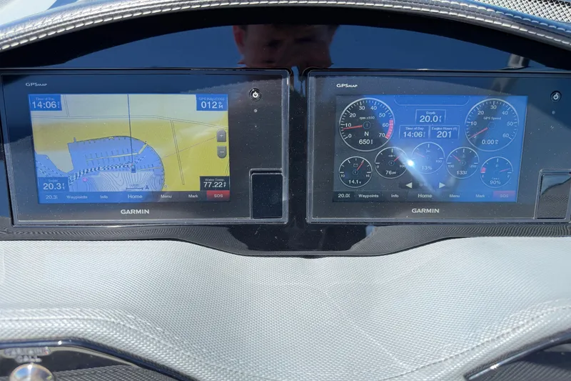 Slide: The Image of Dashboard of a 2020 Cobalt R3 boat with Garmin GPS displays. - 25