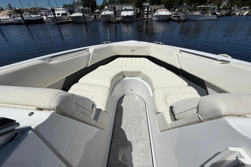 Slide: The Image of Luxurious seating area on a 2020 Cobalt R3 boat, docked at a marina. - 4