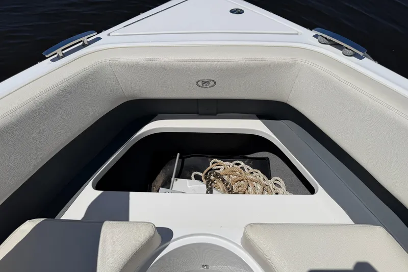 Slide: The Image of 2020 Cobalt R3 boat interior with open storage compartment and coiled rope. - 5
