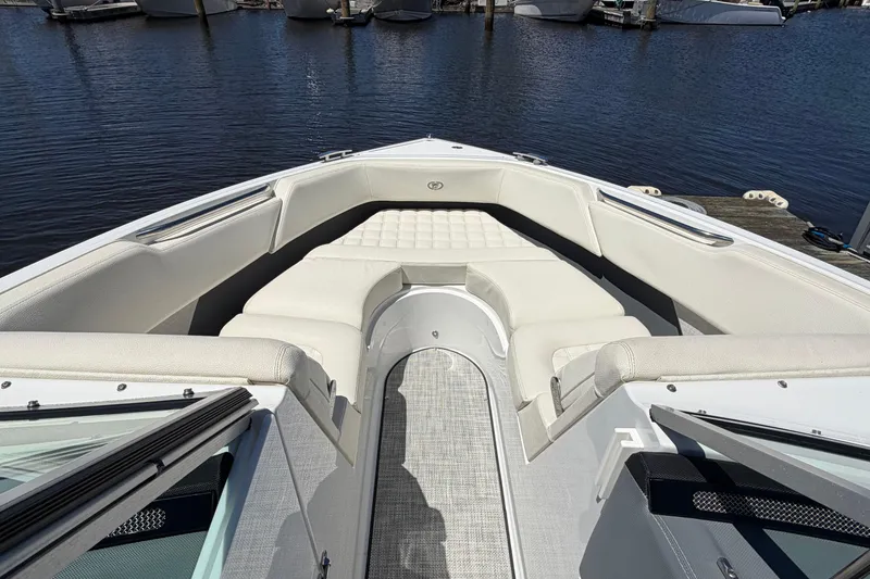 Slide: The Image of 2020 Cobalt R3 boat interior with white seating, docked by the water. - 7