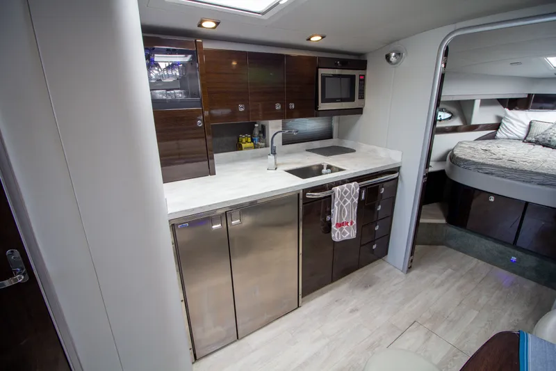 Slide: The Image of Interior of 2016 Formula 40 Performance Cruiser with kitchen and sleeping area. - 18