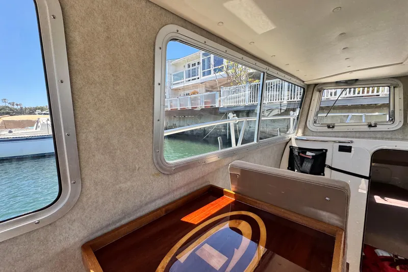 Slide: The Image of Interior of a 2016 Defiance San Juan 250 boat with dockside view. - 12