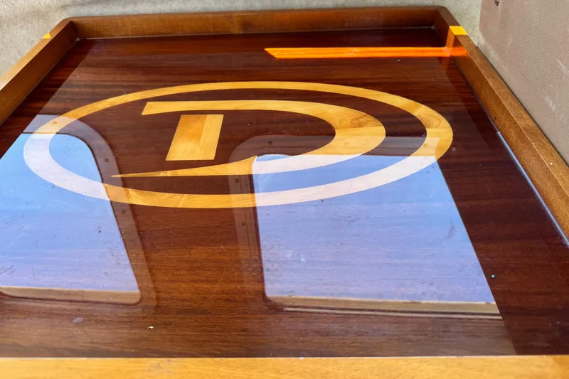 Slide: The Image of Polished wooden surface with Defiance logo on San Juan 250, 2016 model. - 54