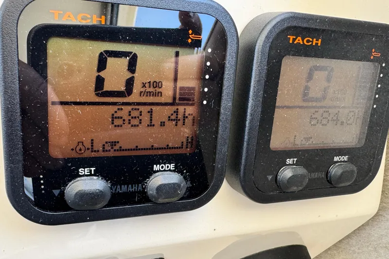 Slide: The Image of Close-up of Yamaha tachometers on a 2016 Defiance San Juan 250 boat dashboard. - 60