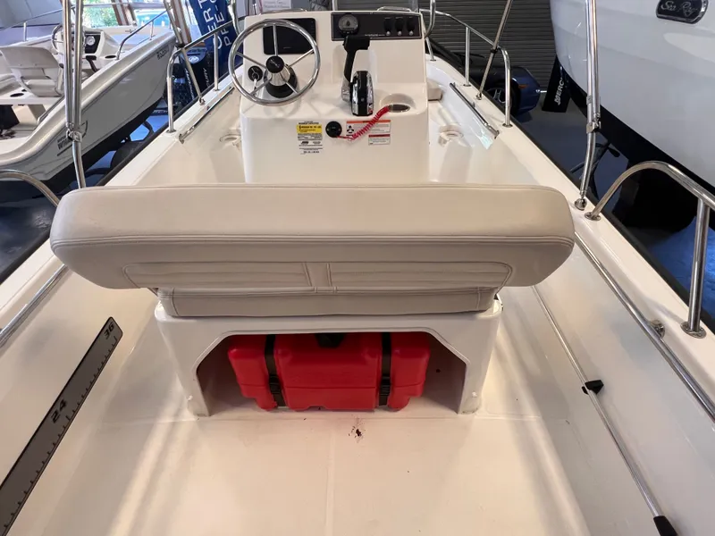 Slide: The Image of Interior view of a 2023 Boston Whaler 150 Montauk boat. - 12