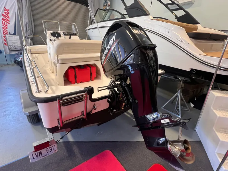 Slide: The Image of Boston Whaler 150 Montauk 2023 with Mercury engine in showroom. - 15