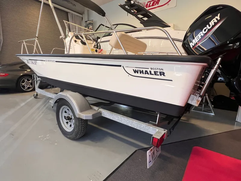 Slide: The Image of Boston Whaler 150 Montauk 2023 on trailer in garage. - 17