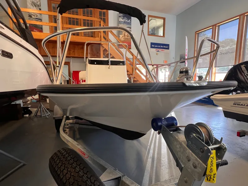 Slide: The Image of Boston Whaler 150 Montauk 2023 in showroom on trailer. - 19