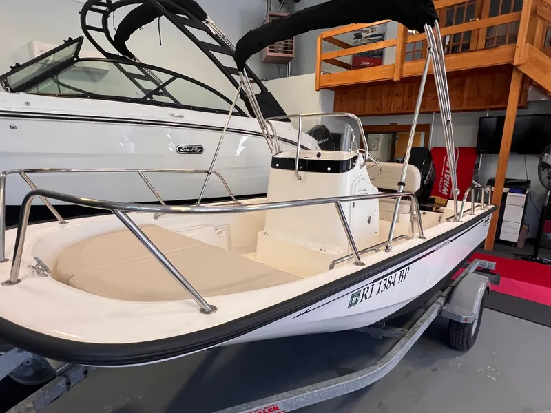 Slide: The Image of 2023 Boston Whaler 150 Montauk on a trailer in a garage. - 3