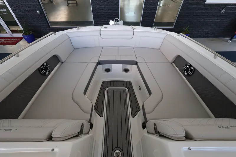 Slide: The Image of The image shows the spacious bow area of a Sea Ray SDX 290 Outboard with sleek upholstery. - 27