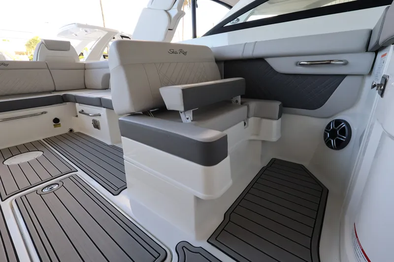 Slide: The Image of The image shows the interior of a 2027 Sea Ray SDX 290 Outboard with sleek gray upholstery. - 16
