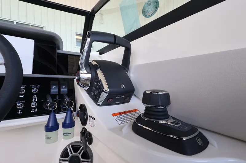 Slide: The Image of Close-up of a Sea Ray SDX 290 Outboard helm with modern controls and joystick. - 23
