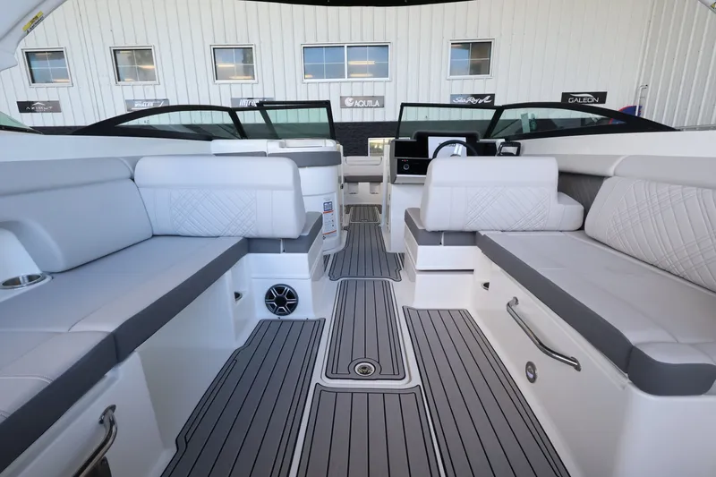 Slide: The Image of Interior of a Sea Ray SDX 290 Outboard with gray upholstery and modern design. - 14