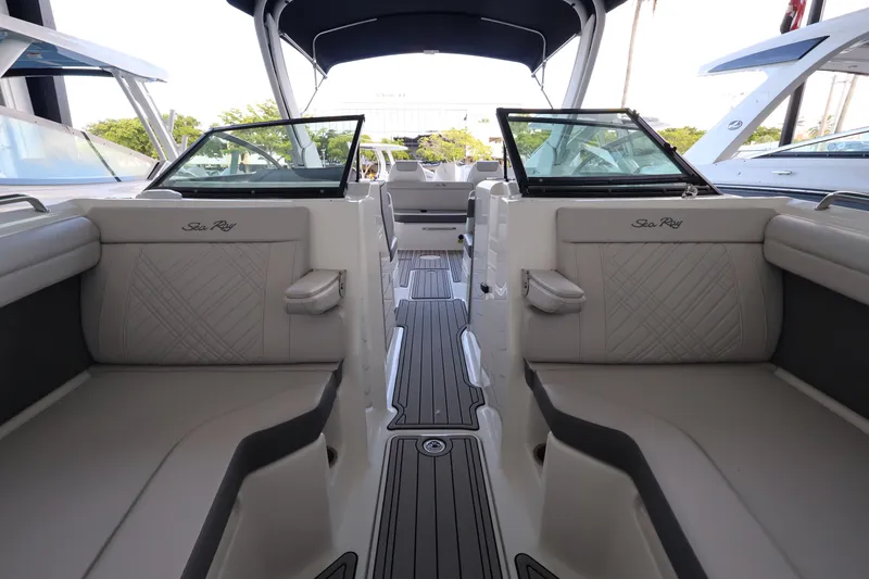 Slide: The Image of Interior view of a Sea Ray SDX 290 Outboard with luxurious seating and modern design. - 28