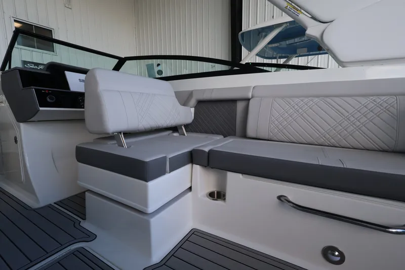Slide: The Image of The image shows the interior of a 2027 Sea Ray SDX 290 Outboard with gray upholstery and modern design. - 20