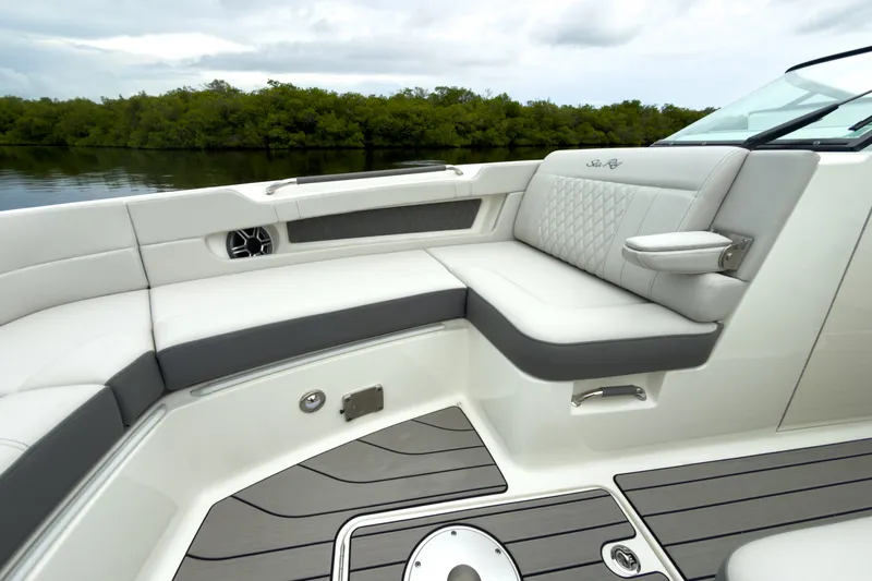 Slide: The Image of The image shows the luxurious cockpit of a Sea Ray SLX 310 Outboard with elegant seating. - 22