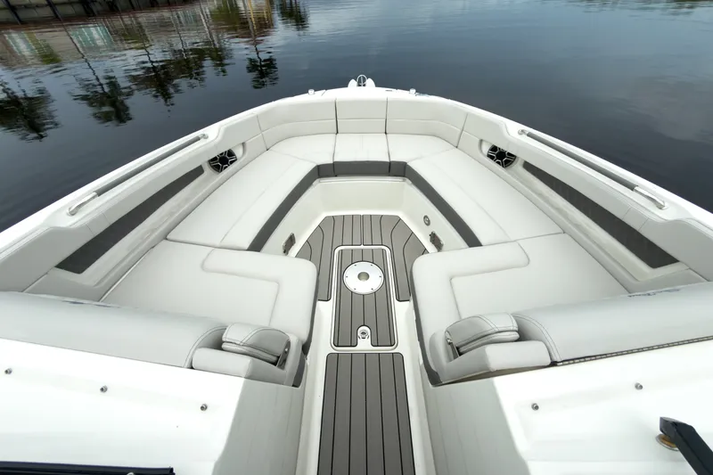 Slide: The Image of The image shows the spacious bow of a Sea Ray SLX 310 Outboard with sleek seating. - 21