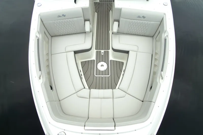 Slide: The Image of The 2027 Sea Ray SLX 310 Outboard features a luxurious, cushioned seating arrangement with elegant detailing. - 25
