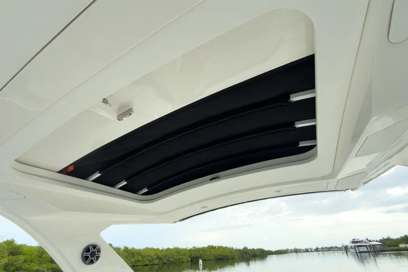 Slide: The Image of The image shows the sunroof of a 2027 Sea Ray SLX 310 Outboard. - 8