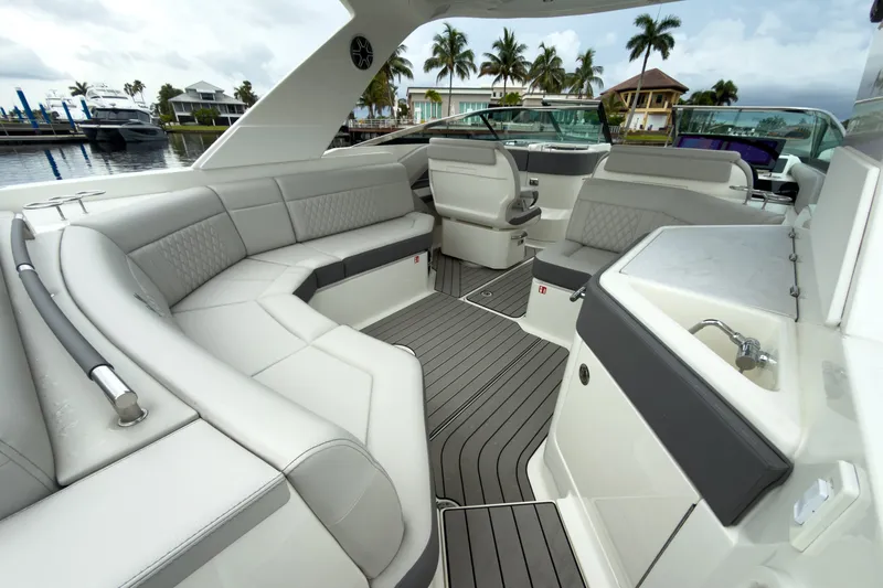 Slide: The Image of The image shows the luxurious cockpit of a Sea Ray SLX 310 Outboard with sleek gray upholstery. - 7
