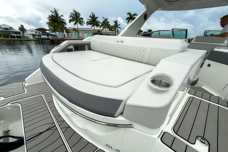 Slide: The Image of The image shows the stern of a 2027 Sea Ray SLX 310 Outboard with sleek white upholstery. - 5