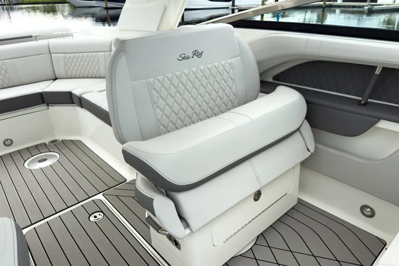 Slide: The Image of The 2027 Sea Ray SLX 310 Outboard features luxurious, cushioned seating with a quilted design. - 17