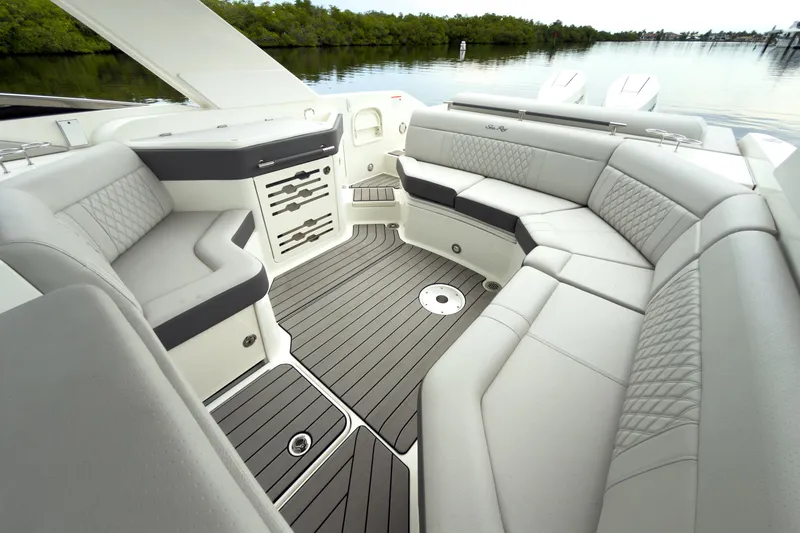 Slide: The Image of The image shows the luxurious cockpit of a Sea Ray SLX 310 Outboard with sleek gray upholstery. - 20