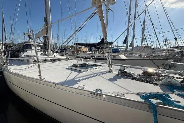 Slide: The Image of Sailboat in marina, Reliance 44 model, 2011, with blue ropes and clear sky. - 12