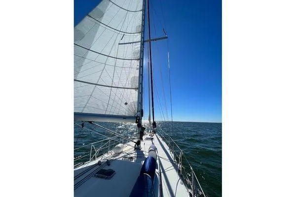 Slide: The Image of Sailing on a 2011 Reliance 44 yacht under clear blue skies. - 3