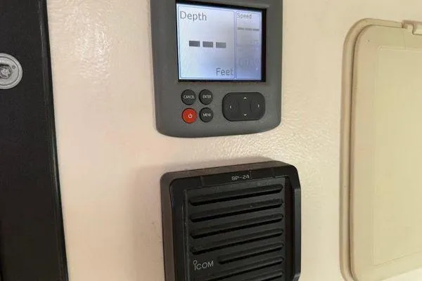 Slide: The Image of Depth gauge and speaker on Reliance 44, 2011 model, displaying depth in feet. - 33