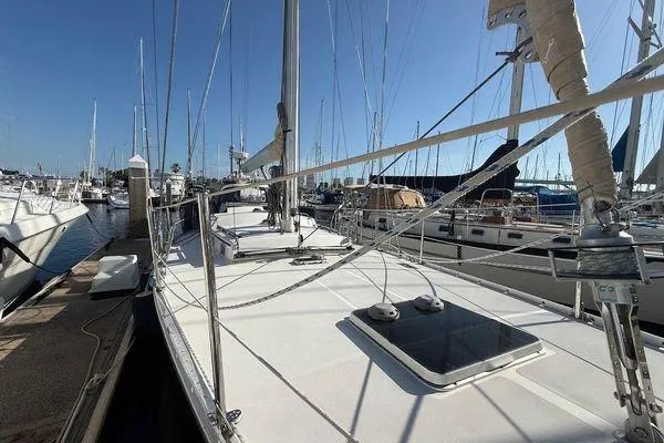 Slide: The Image of Sailboat docked at marina, Reliance 44 model, 2011, with clear blue sky. - 5