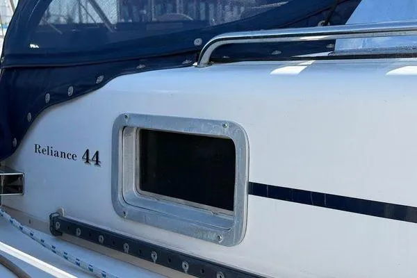 Slide: The Image of 2011 Reliance 44 boat with window and blue canopy detail. - 6
