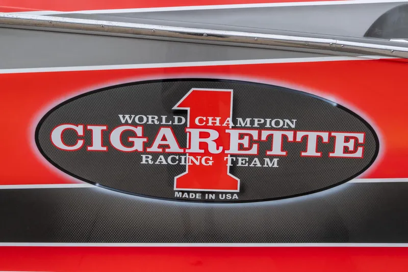 Slide: The Image of 2006 Cigarette 39' Top Gun Unlimited, World Champion Racing Team logo, red and black design. - 14