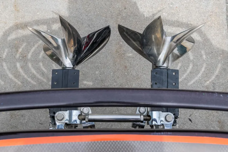 Slide: The Image of Dual propellers of a 2006 Cigarette 39' Top Gun Unlimited boat on concrete surface. - 19