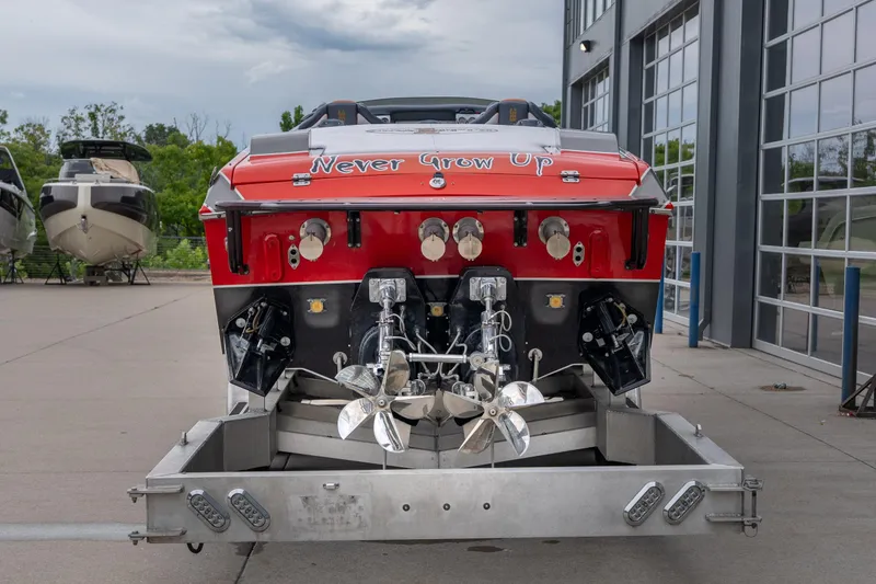 Slide: The Image of 2006 Cigarette 39' Top Gun Unlimited boat with "Never Grow Up" text on the stern. - 21