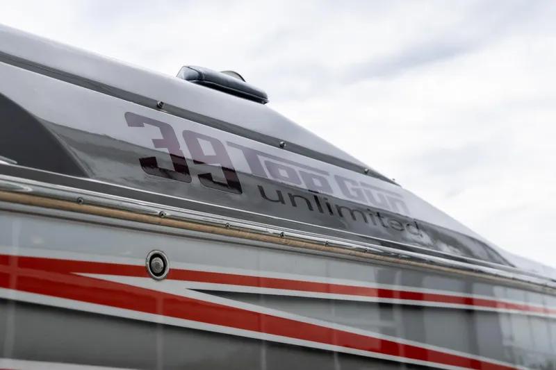 Slide: The Image of 2006 Cigarette 39' Top Gun Unlimited boat with sleek design and bold graphics. - 25