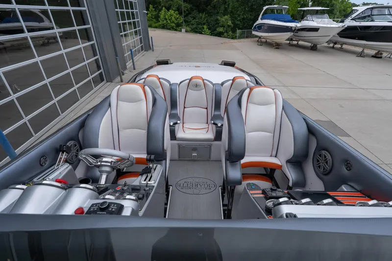 Slide: The Image of 2006 Cigarette 39' Top Gun Unlimited boat interior with sleek seating and modern controls. - 28