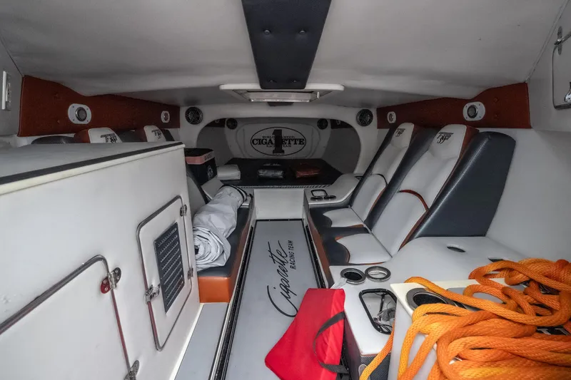 Slide: The Image of Interior of 2006 Cigarette 39' Top Gun Unlimited boat with seating and storage. - 32
