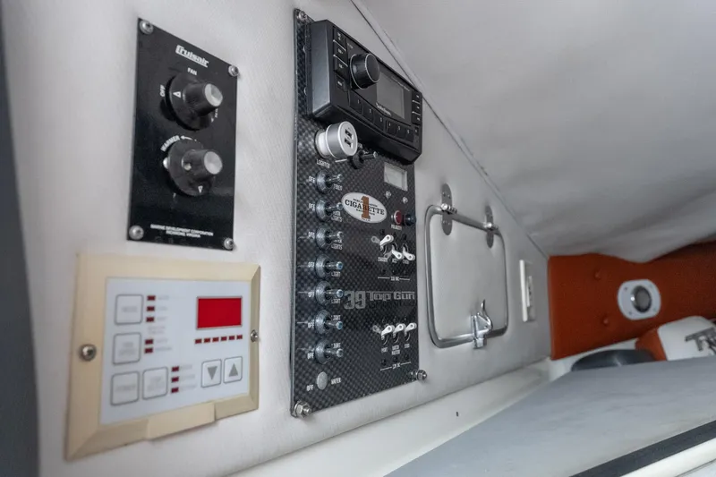 Slide: The Image of Control panel of a 2006 Cigarette 39' Top Gun Unlimited boat interior. - 33