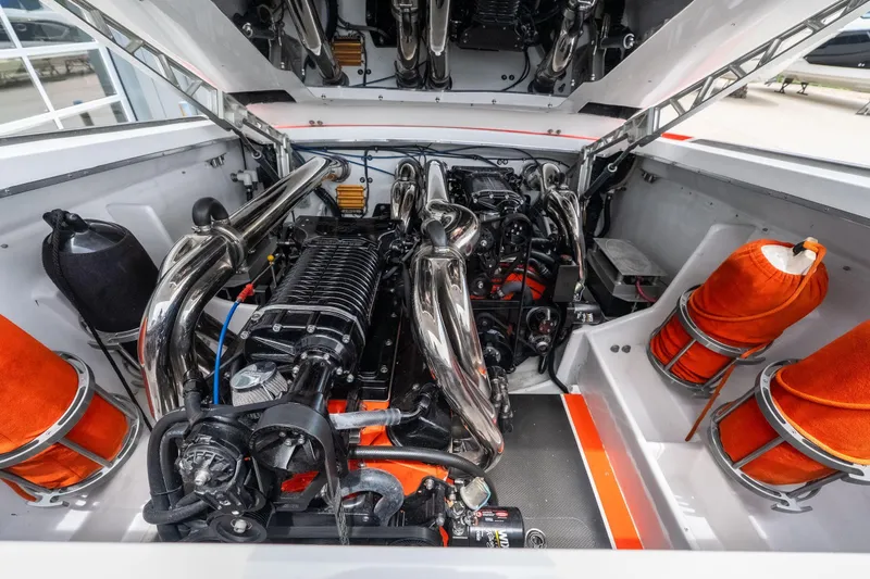 Slide: The Image of Engine compartment of a 2006 Cigarette 39' Top Gun Unlimited boat, showcasing powerful machinery. - 34