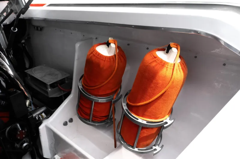 Slide: The Image of Orange fenders in a 2006 Cigarette 39' Top Gun Unlimited boat interior. - 35