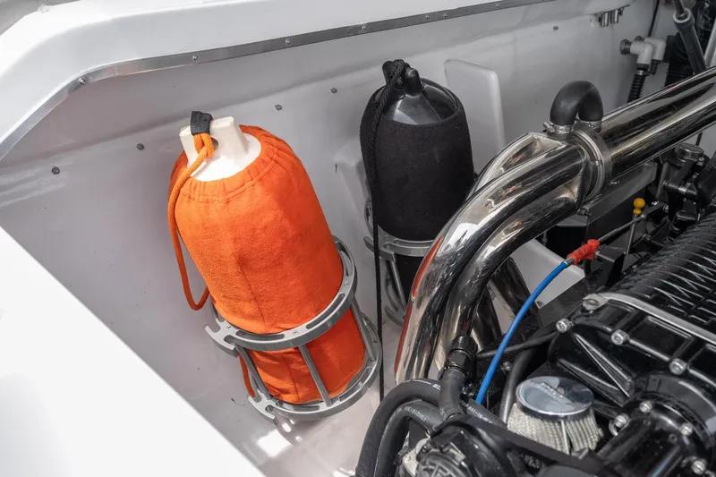 Slide: The Image of Engine compartment of a 2006 Cigarette 39' Top Gun Unlimited boat with visible components. - 36