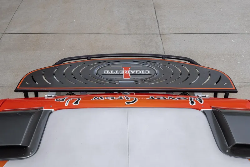 Slide: The Image of Top view of a 2006 Cigarette 39' Top Gun Unlimited boat with distinctive design elements. - 37