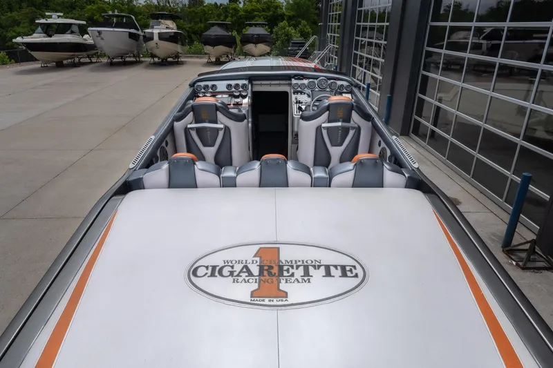 Slide: The Image of 2006 Cigarette 39' Top Gun Unlimited boat interior with branded seating and dashboard. - 38