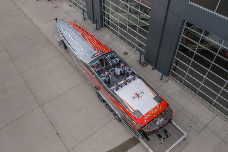 Slide: The Image of 2006 Cigarette 39' Top Gun Unlimited speedboat on trailer, aerial view. - 9