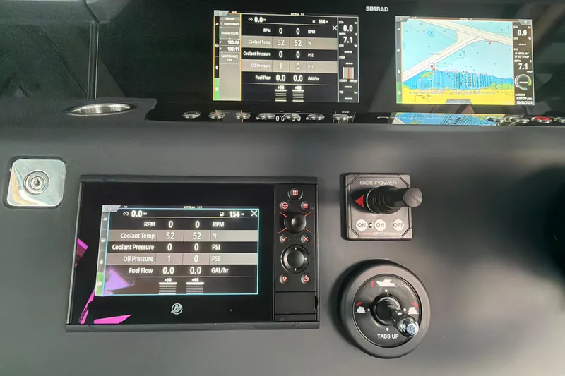 Slide: The Image of Dashboard of 2022 Axopar Brabus 37 XC Cross Cabin with navigation and control displays. - 17