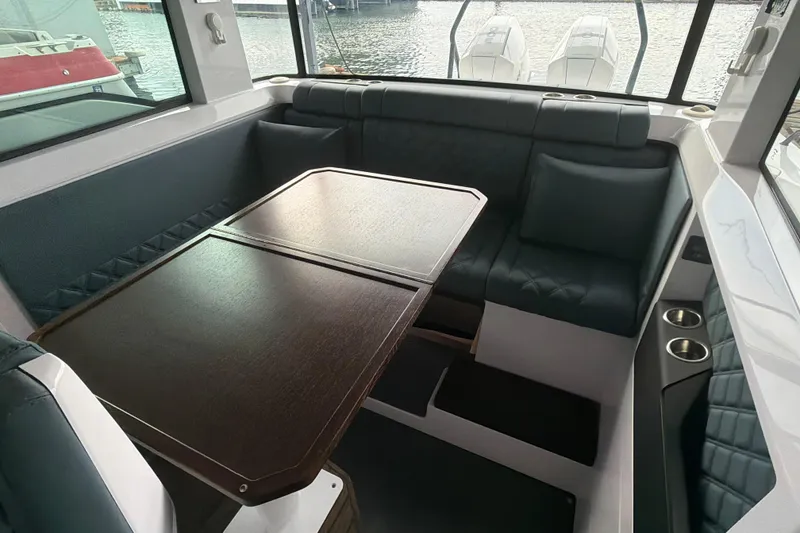 Slide: The Image of Luxurious interior of 2022 Axopar Brabus 37 XC Cross Cabin with elegant seating and table. - 20